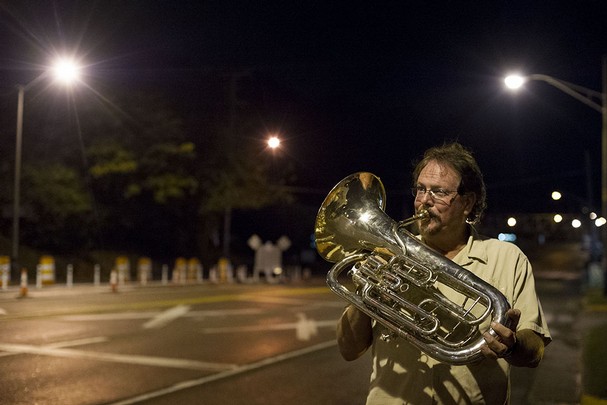 Steve Boyce, owner of Rush's Music plays the euphonium in celebration of the opening of Henley Bridge on Thursday, October 17, 2013. (SAUL YOUNG/NEWS SENTINEL)