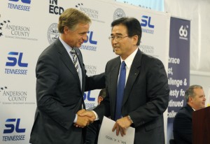Gov. Bill Haslam shakes hands with Y.K. Woo, president of South Korean auto parts maker SL America after an announcement of expansion of its Anderson County plant. TVA contributed a hidden amount of incentives to the deal.