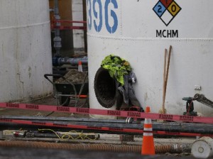 Work continues around a storage tank with the chemical designation MCHM, 4-methylcyclohexane methanol, the chemical that leaked into the Elk River, at Freedom Industries storage facility in Charleston, W.Va., Monday, Jan. 13, 2014.